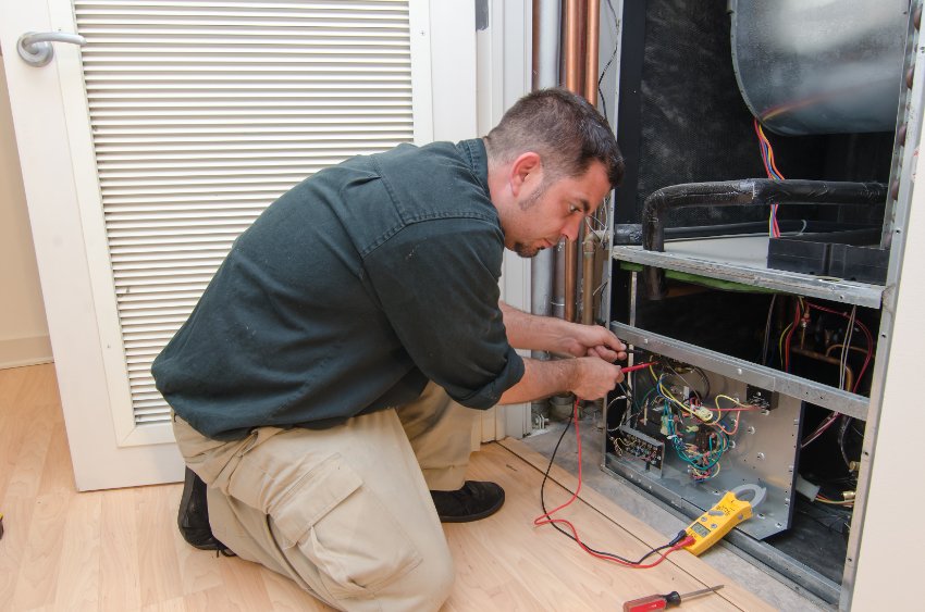 a man checking the hvac system performance